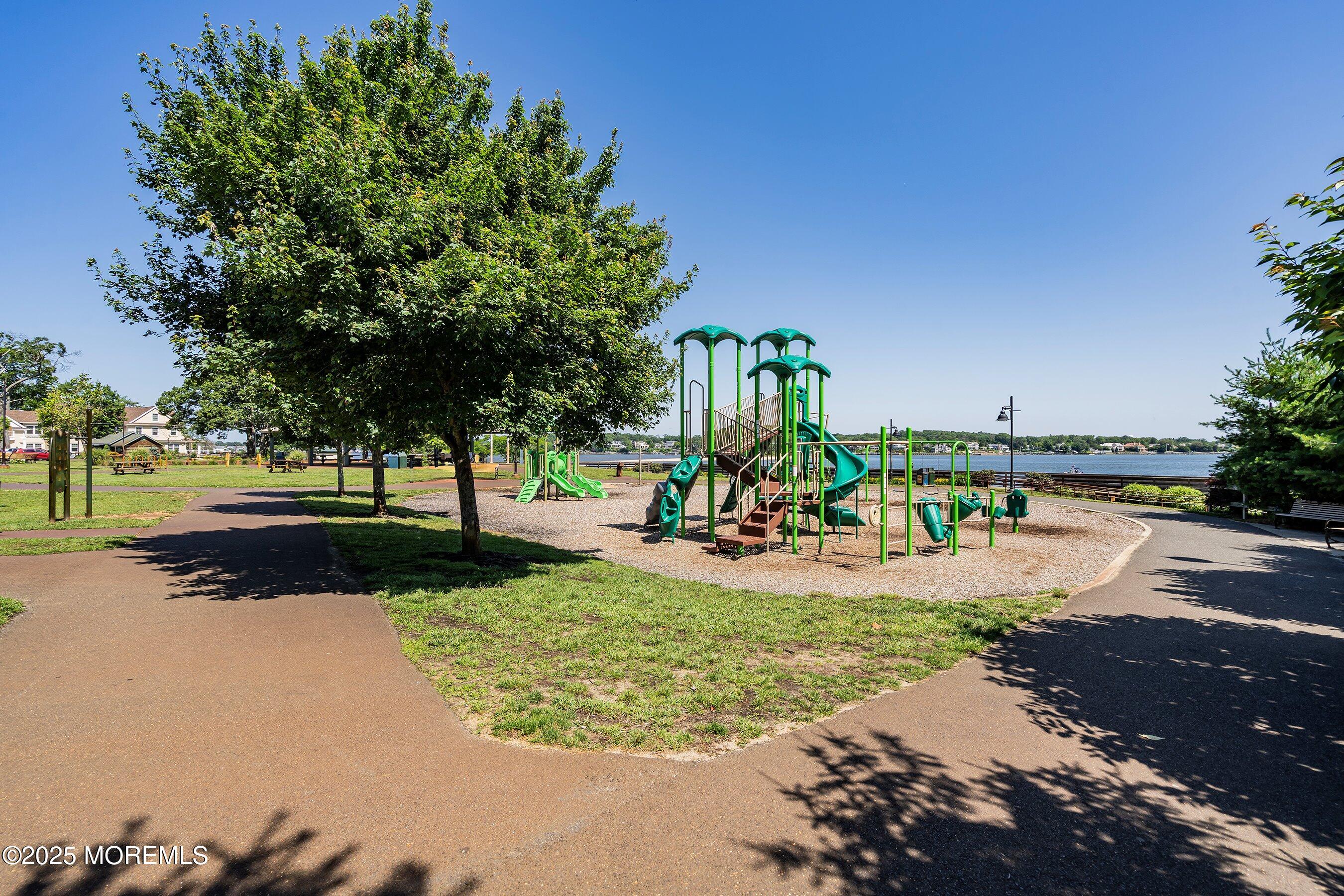 309 Hall Avenue Point Pleasant, NJ 08742 - Photo 34 of 35 a view of a park with swings and slides
