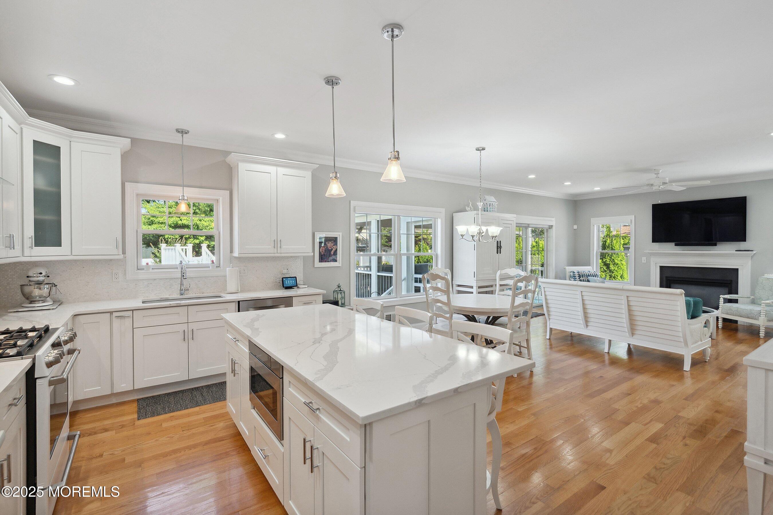 309 Hall Avenue Point Pleasant, NJ 08742 - Photo 7 of 35 a large kitchen with kitchen island a large counter top space appliances and a sink