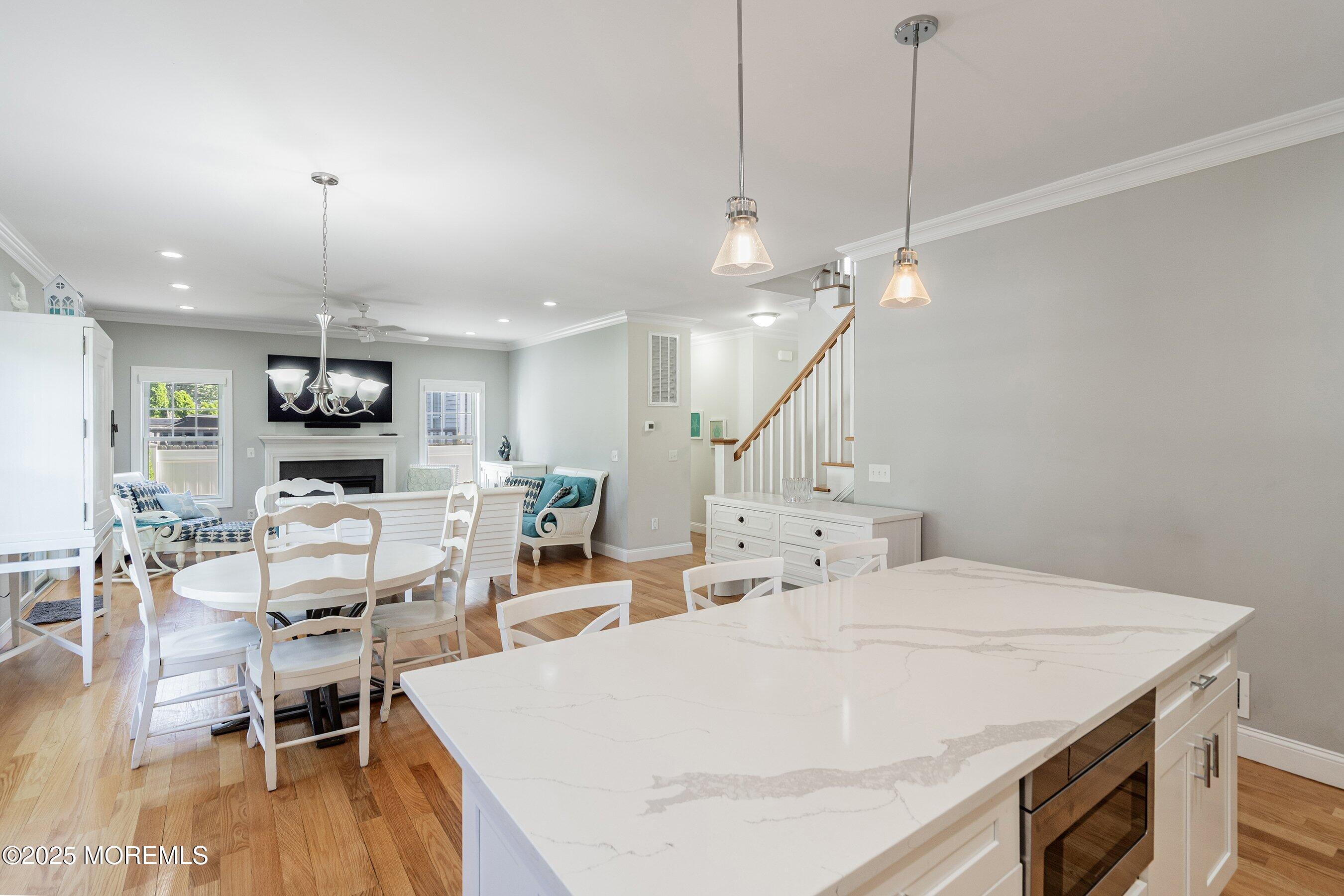309 Hall Avenue Point Pleasant, NJ 08742 - Photo 8 of 35 a large white kitchen with a table and chairs