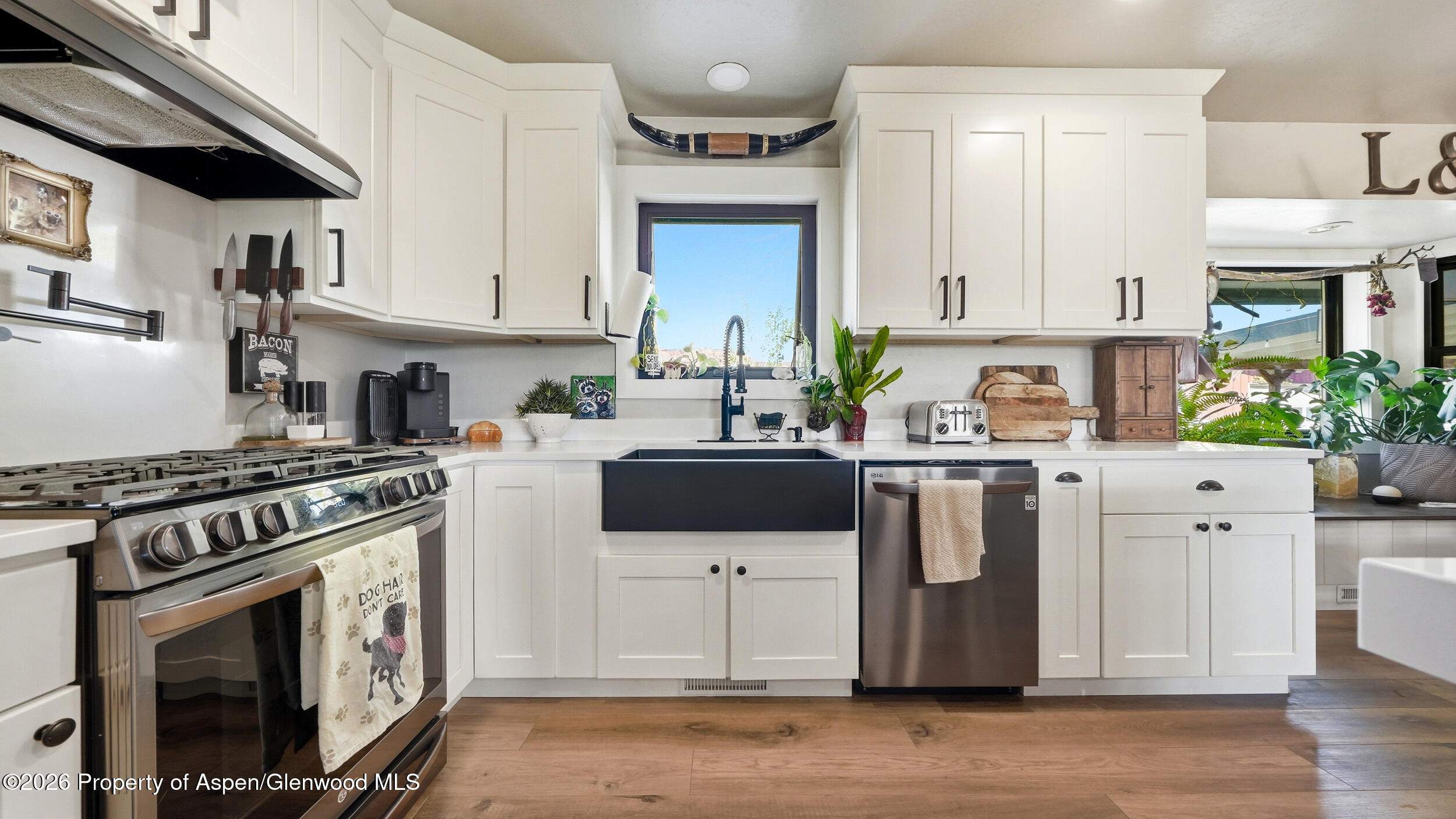 445 South Camp Road Grand Junction, CO 81507 - Photo 12 of 37 a kitchen with stainless steel appliances a stove a sink a refrigerator and cabinets