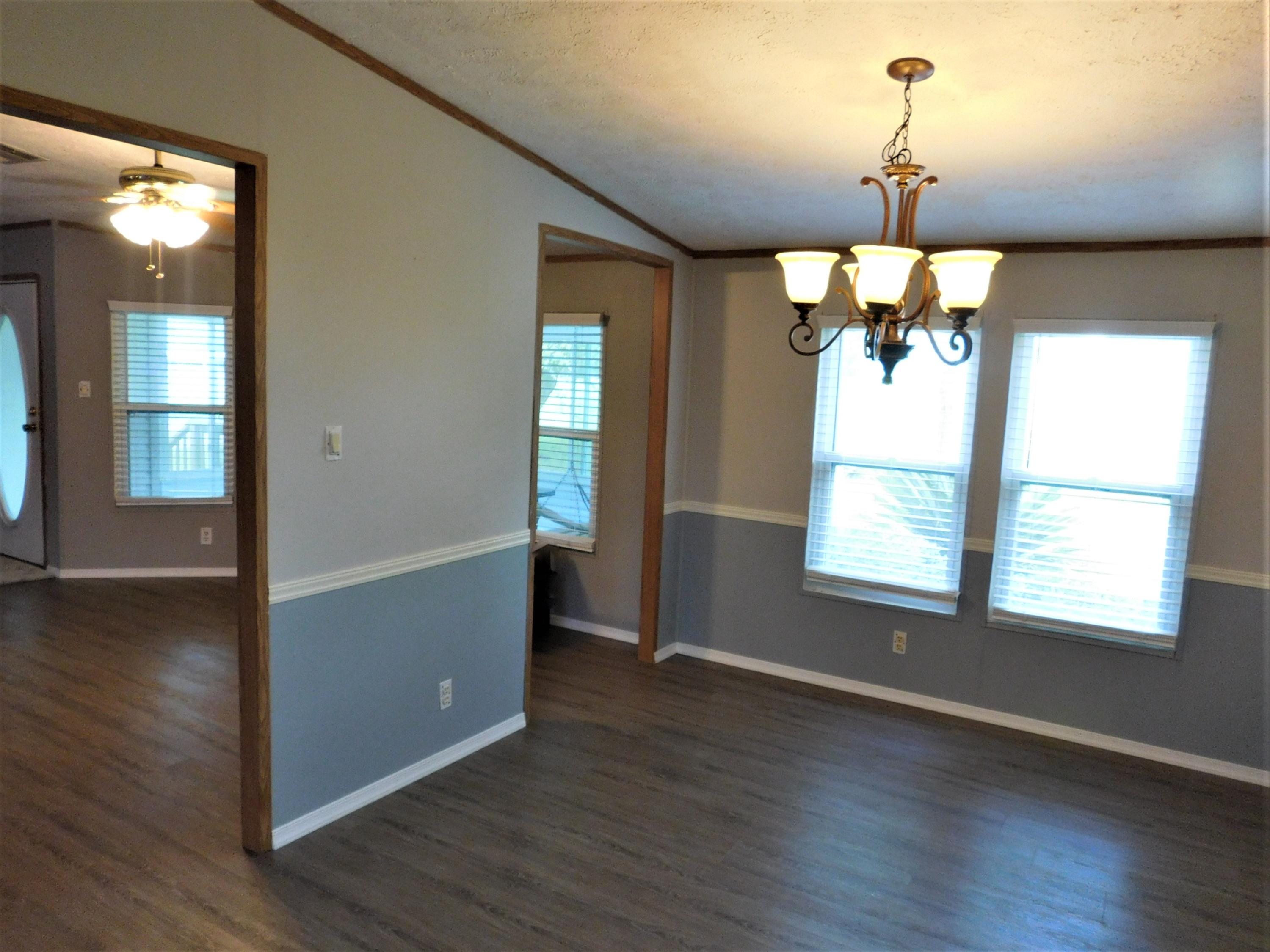 1533 Messick Road Baker, FL 32531 - Photo 20 of 40 wooden floor in an empty room with a window