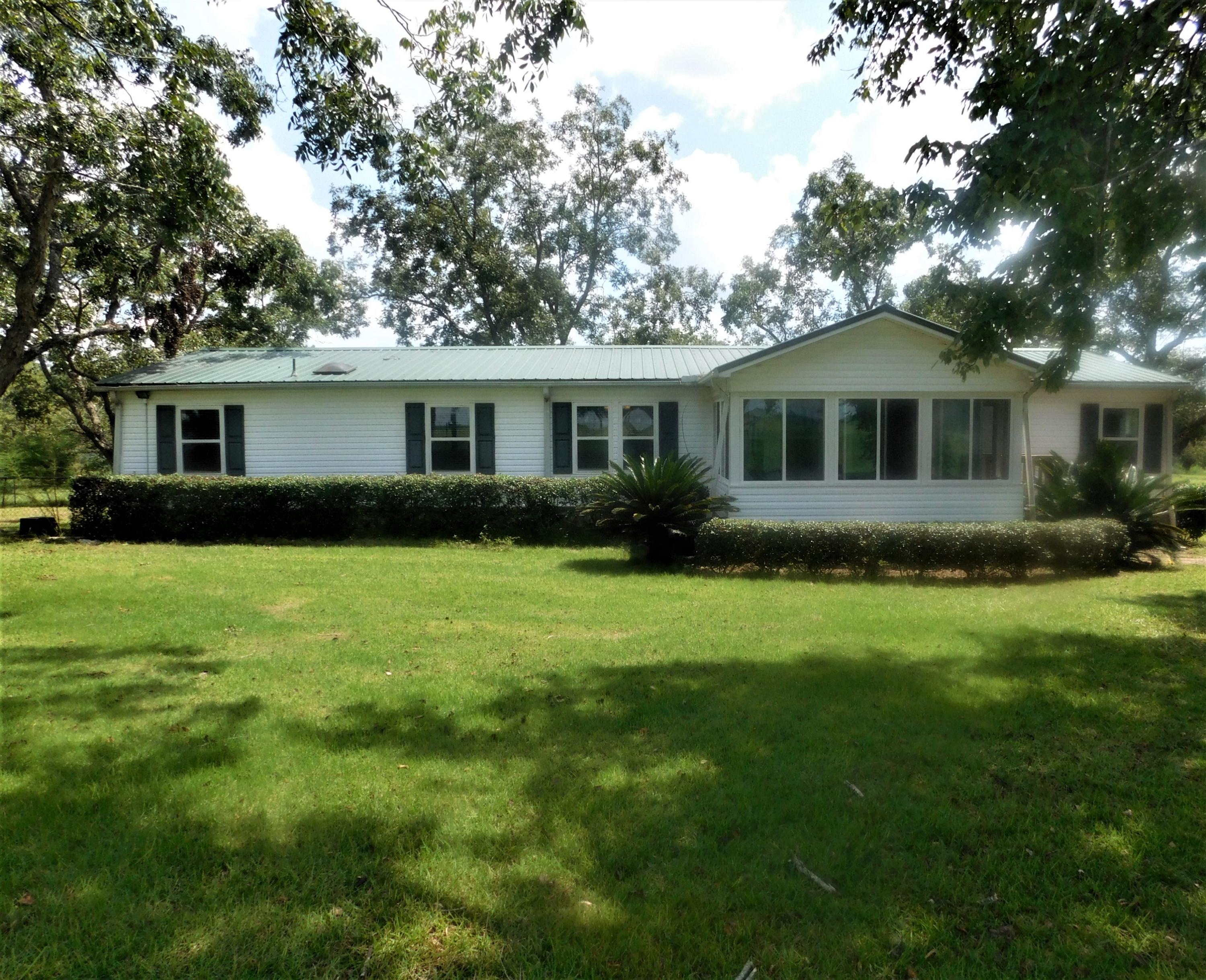 1533 Messick Road Baker, FL 32531 - Photo 3 of 40 a front view of house with yard and green space