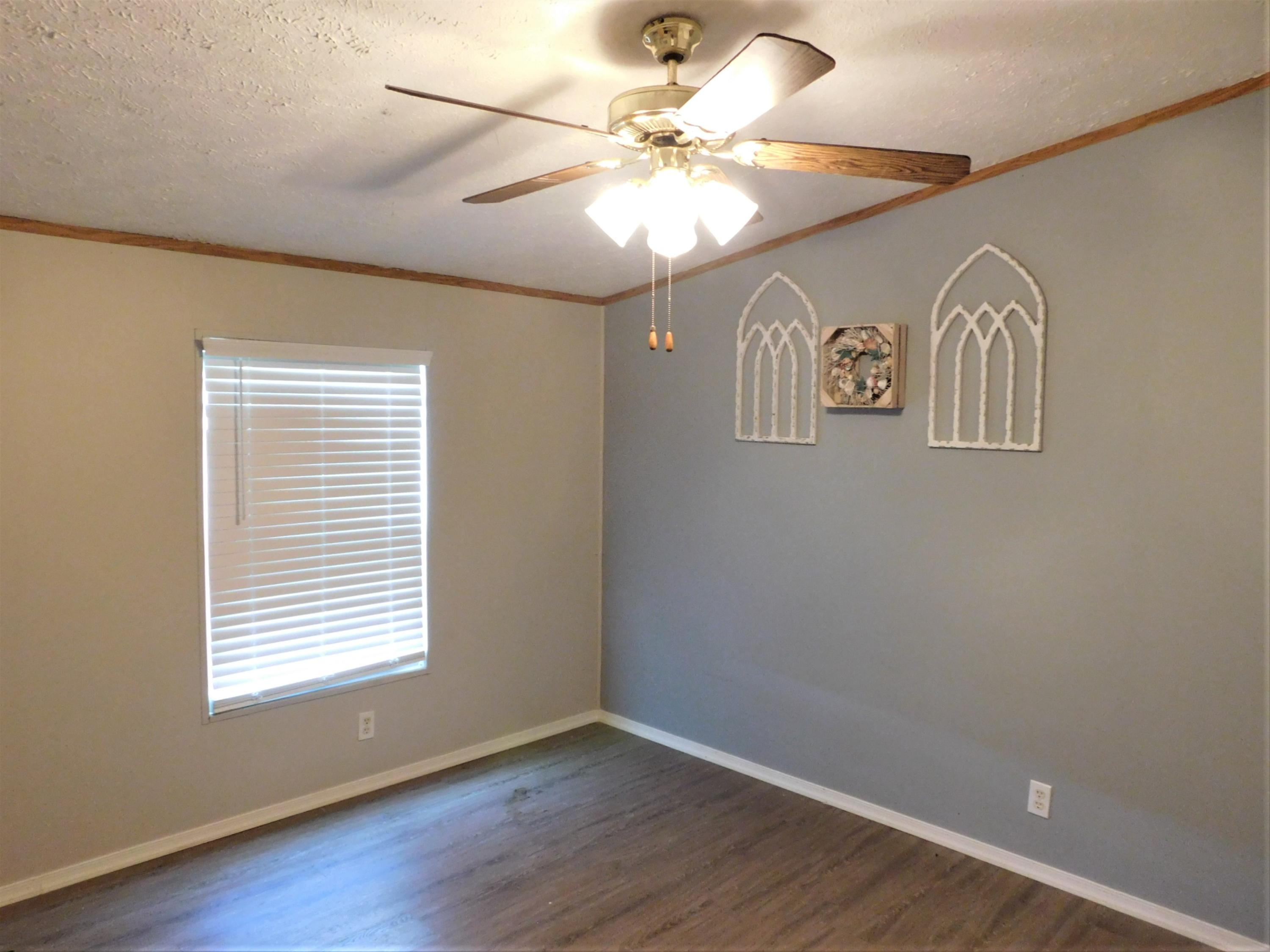 1533 Messick Road Baker, FL 32531 - Photo 25 of 40 wooden floor in an empty room with a window