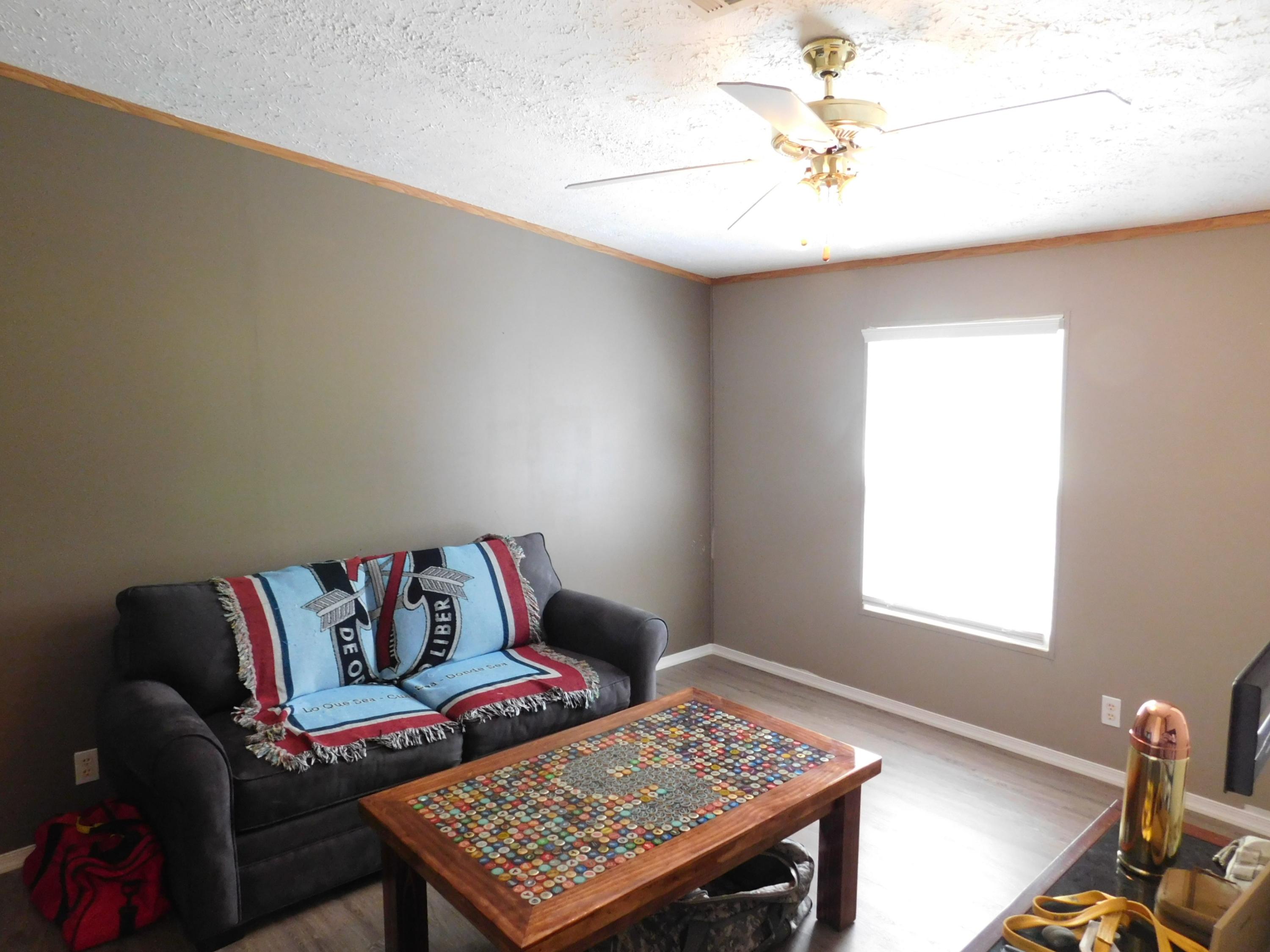 1533 Messick Road Baker, FL 32531 - Photo 27 of 40 a living room with furniture and a window