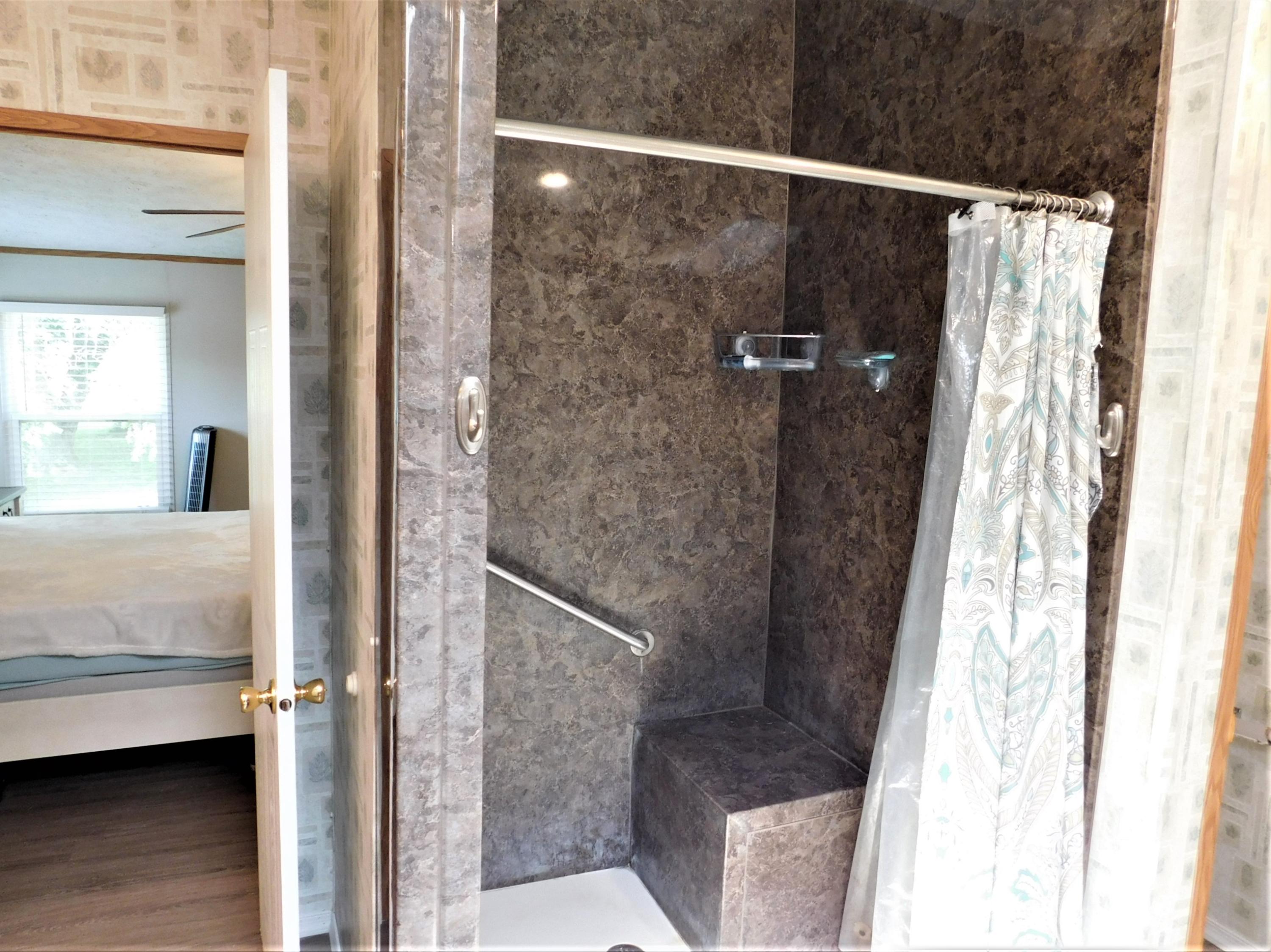 1533 Messick Road Baker, FL 32531 - Photo 31 of 40 a bathroom with a shower