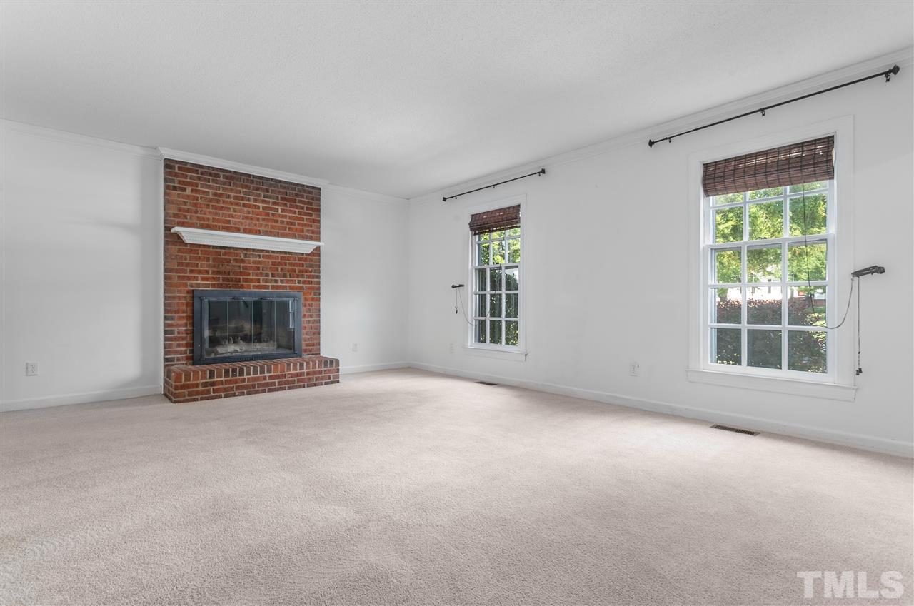 2012 Hunterfield Lane Raleigh, NC 27609 - Photo 8 of 27 a view of empty room with a fireplace