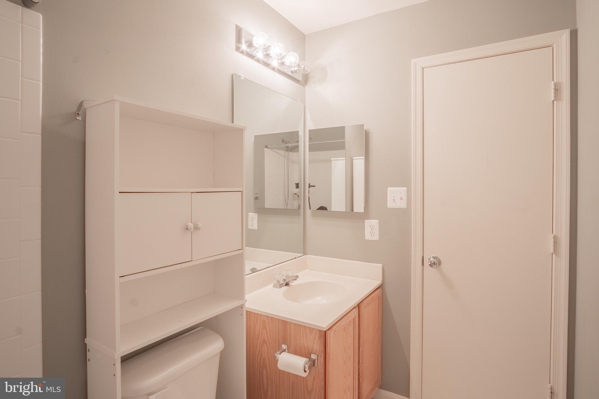 104 Penwick Circle Frederick, MD 21702 - Photo 16 of 24 a bathroom with a sink a mirror and a shower
