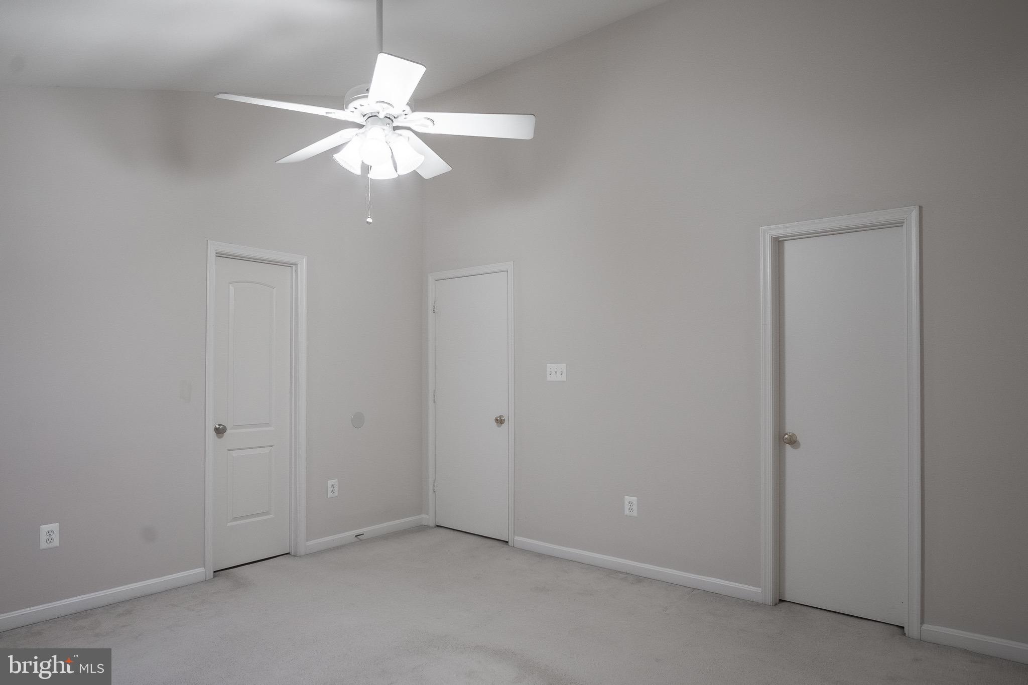 104 Penwick Circle Frederick, MD 21702 - Photo 17 of 24 an empty room with a ceiling fan and a window