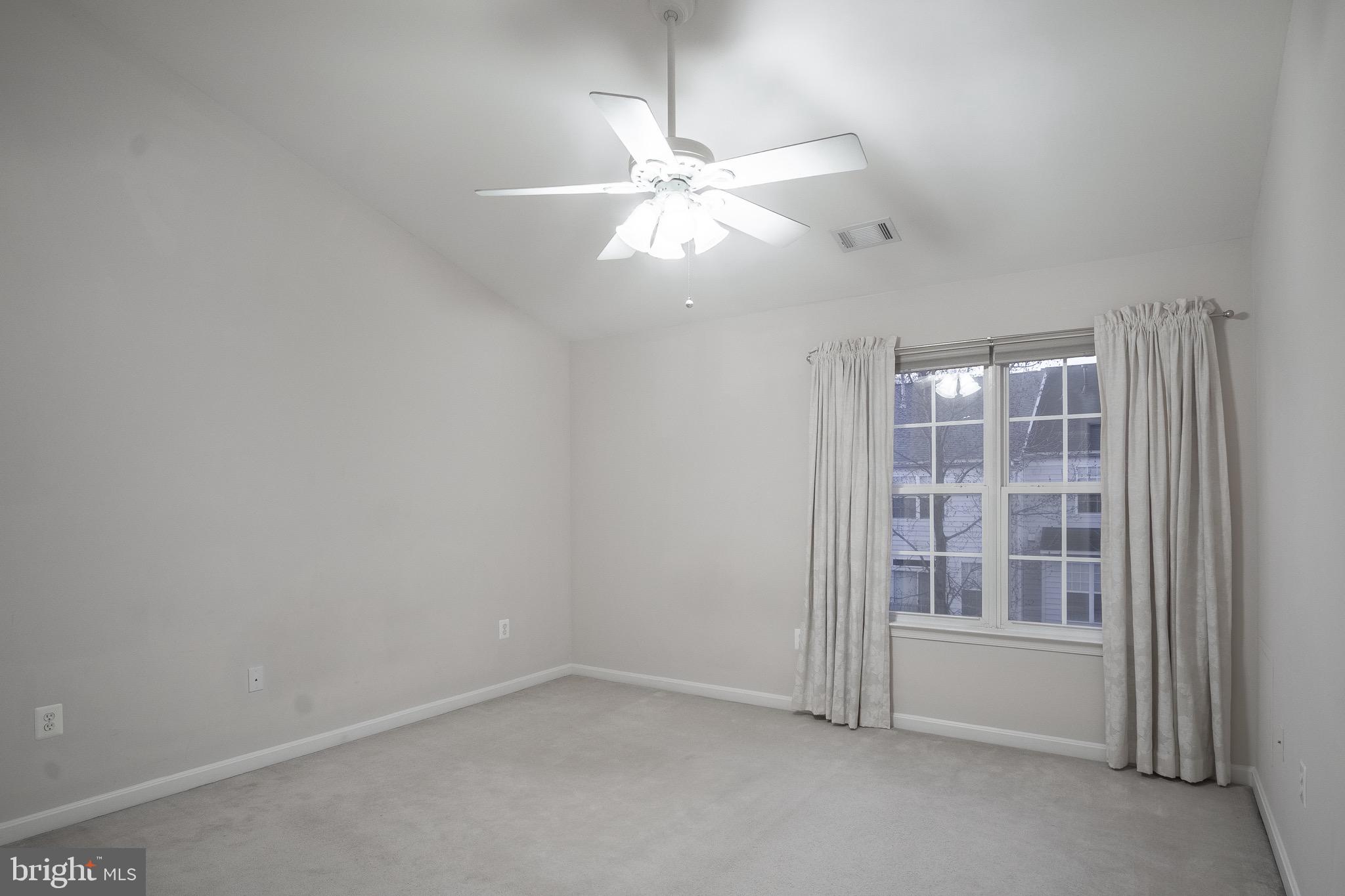 104 Penwick Circle Frederick, MD 21702 - Photo 18 of 24 an empty room with windows and fan