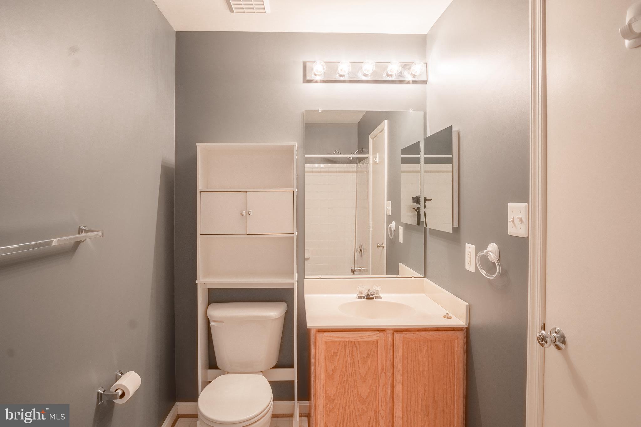104 Penwick Circle Frederick, MD 21702 - Photo 22 of 24 a bathroom with a toilet sink and mirror