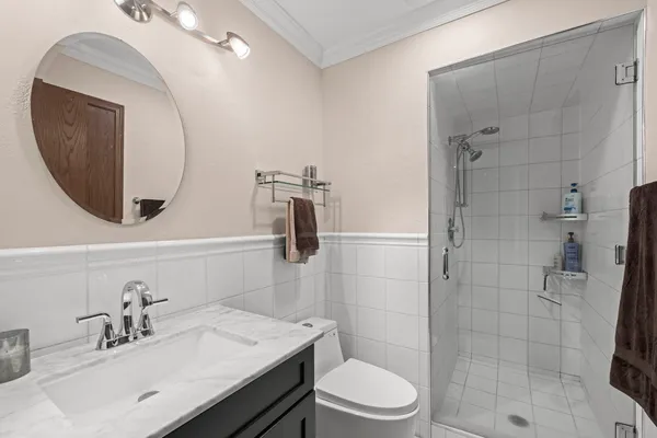 a bathroom with a sink toilet and shower