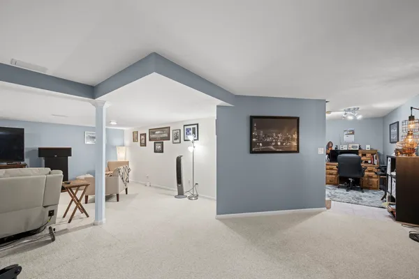 a view of a livingroom with furniture and a flat screen tv