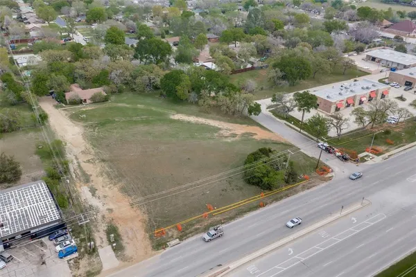 an aerial view of a residential houses with outdoor space