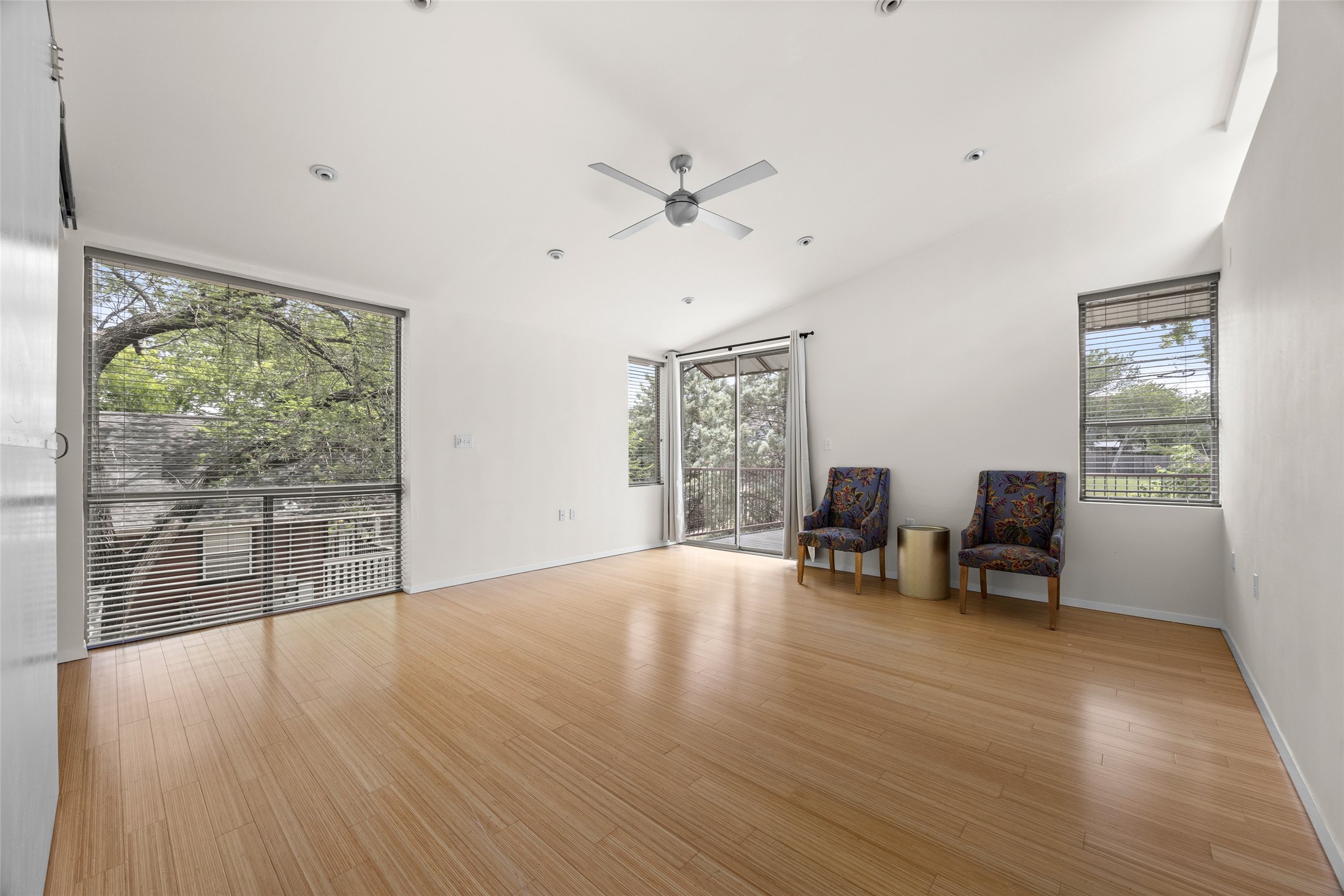 1305 Chestnut Avenue Austin, TX 78702 - Photo 29 of 40 Well-lit living area with hardwood flooring and high ceilings provides a comfortable, inviting atmosphere.