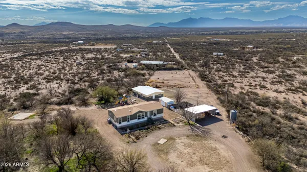 an aerial view of residential house with beach