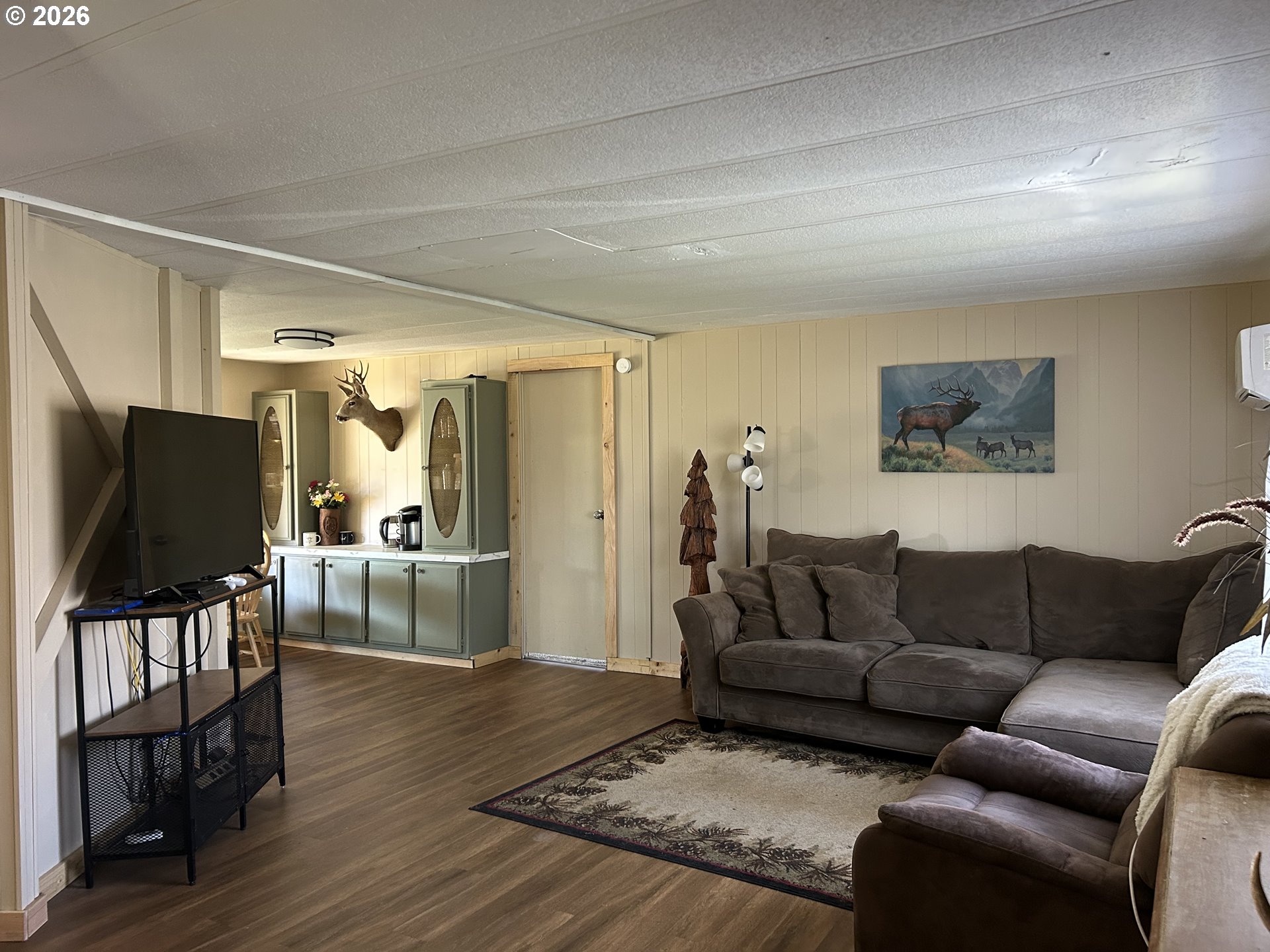355 North 8th Street Lakeside, OR 97449 - Photo 8 of 22 a living room with furniture and a flat screen tv