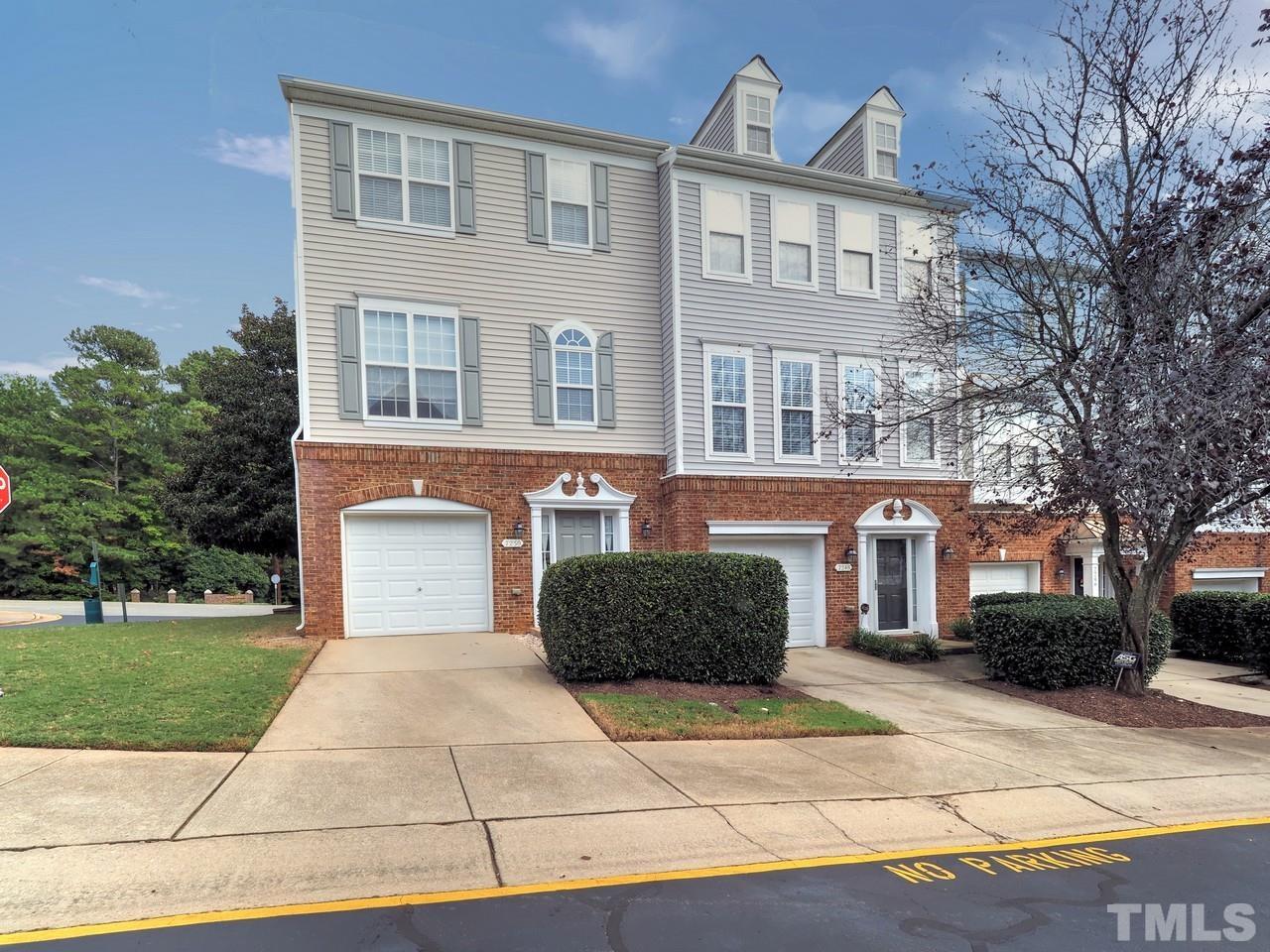 7250 Galon Glen Road Raleigh, NC 27613 - Photo 1 of 27 a front view of a house with a garden