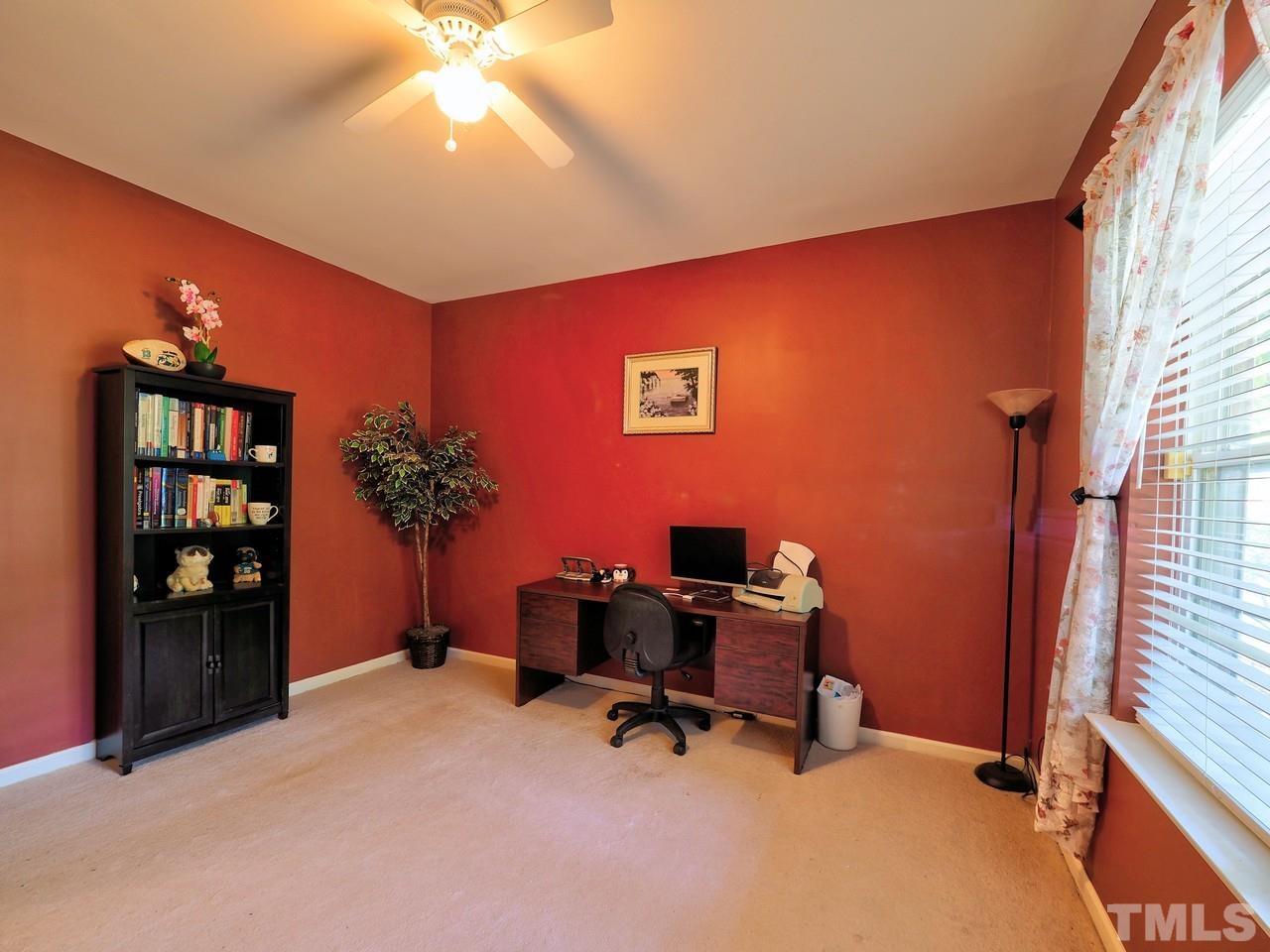 7250 Galon Glen Road Raleigh, NC 27613 - Photo 5 of 27 a view of a workspace with furniture and a window
