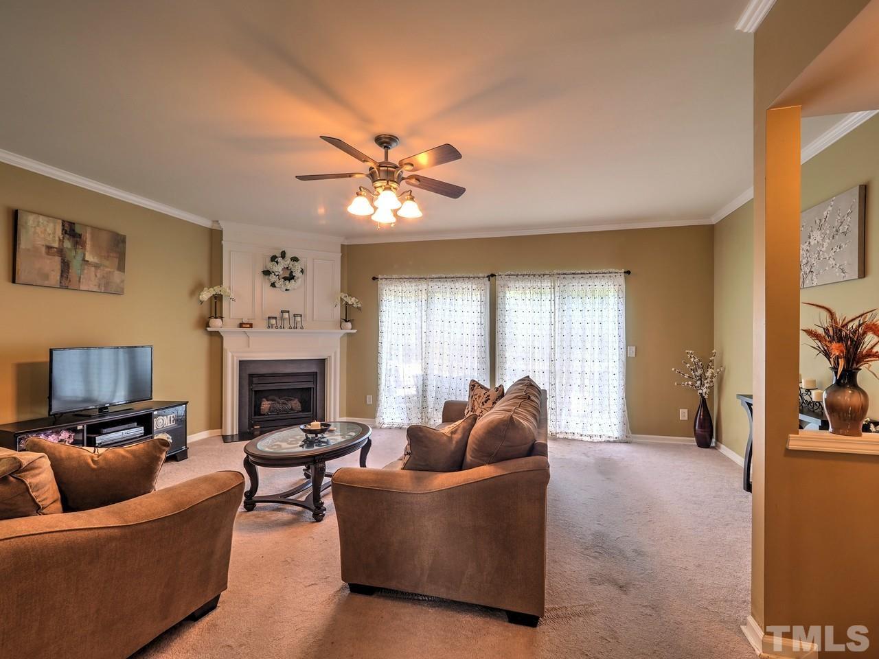 7250 Galon Glen Road Raleigh, NC 27613 - Photo 6 of 27 a living room with furniture and a fireplace