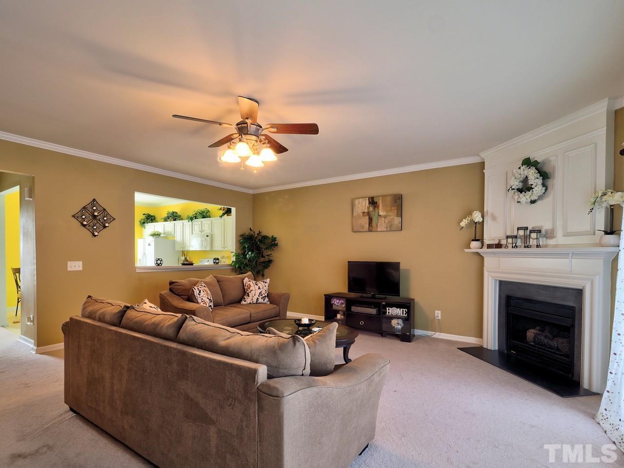 7250 Galon Glen Road Raleigh, NC 27613 - Photo 9 of 27 a living room with furniture and a fireplace