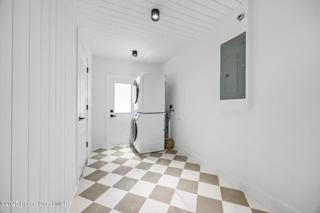 a bathroom with a checkered floor and a shower