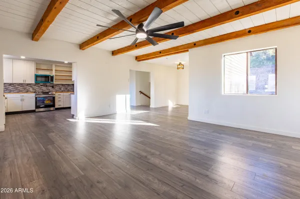 a view of a livingroom with furniture and wooden floor