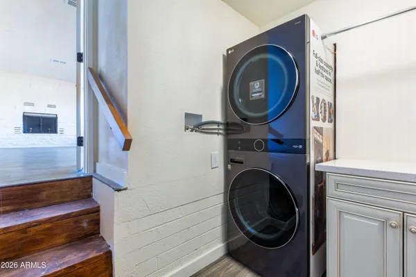 a view of a hallway with washer and dryer
