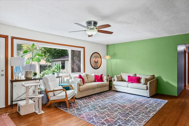 a living room with furniture and a rug