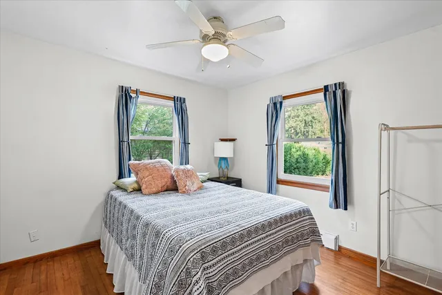 a bedroom with a large bed and a window