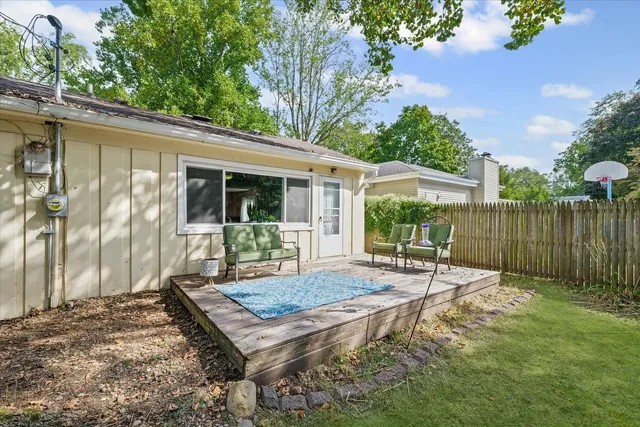 a view of a backyard with a sitting area