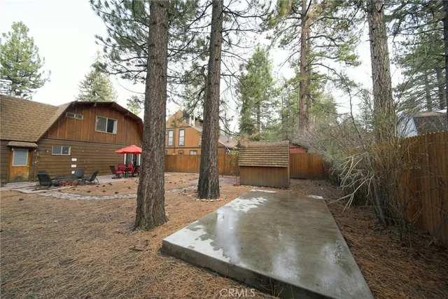 a view of a house with a yard covered in snow