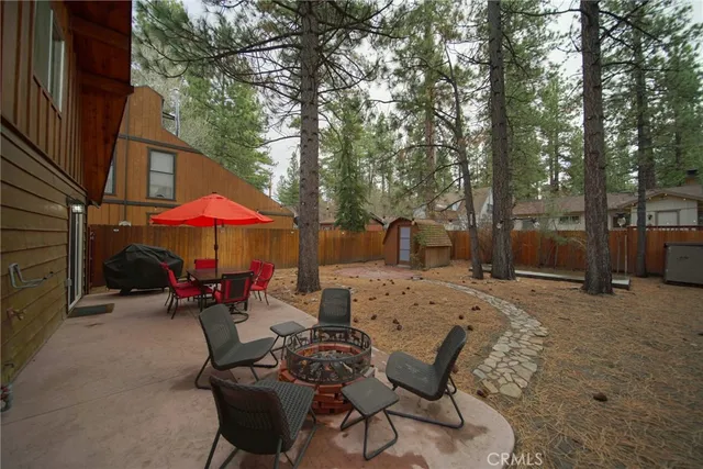 a view of a tables and chairs under an umbrella