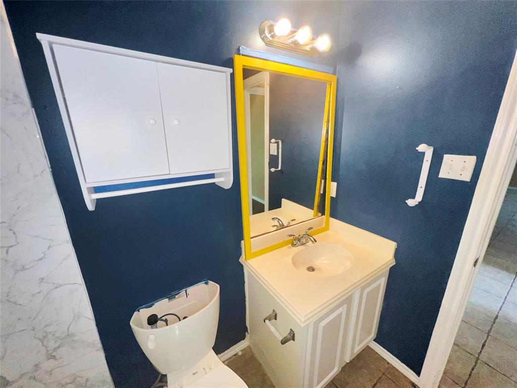 3661 Emo Street Midlothian, TX 76065 - Photo 13 of 24 view of bathroom with a sink and mirror