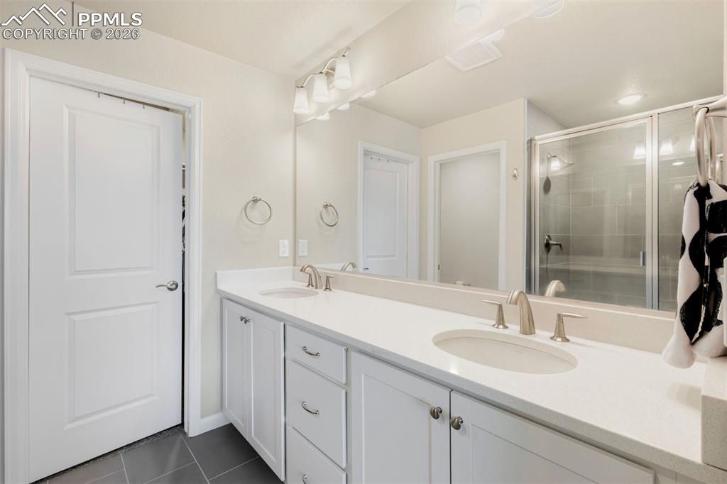 2028 Peridot Loop Colorado Springs, CO 80908 - Photo 16 of 24 Double vanities in Primary Bathroom