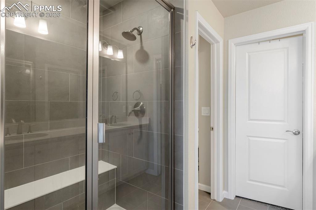 2028 Peridot Loop Colorado Springs, CO 80908 - Photo 17 of 24 Primary Bathroom with water closet and walk in closet