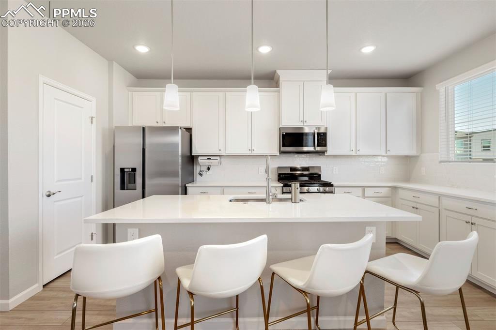 2028 Peridot Loop Colorado Springs, CO 80908 - Photo 10 of 24 Gourmet kitchen with a gas range and large pantry