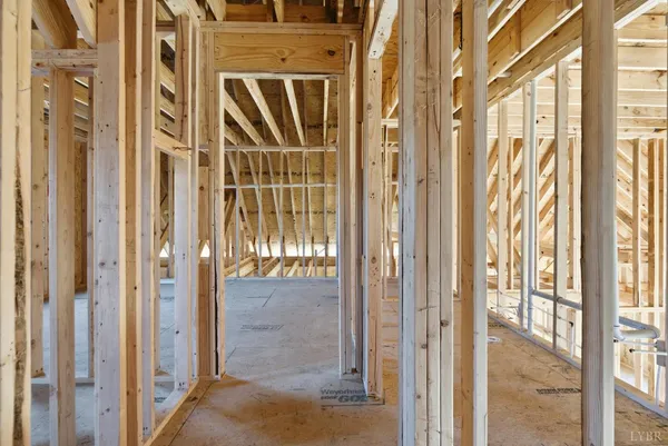 a view of an empty room with a sliding door and wooden floor