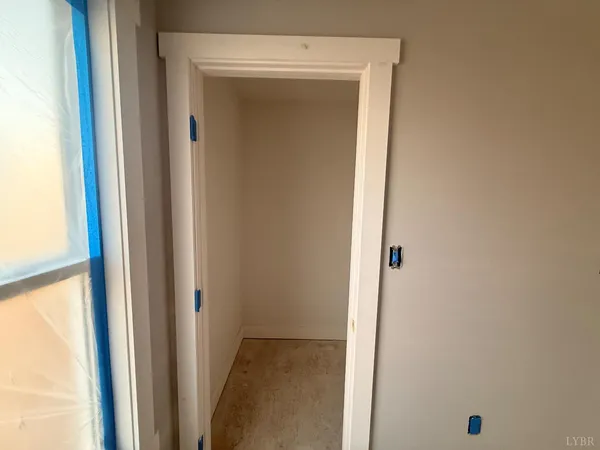 a view of an empty room with a window