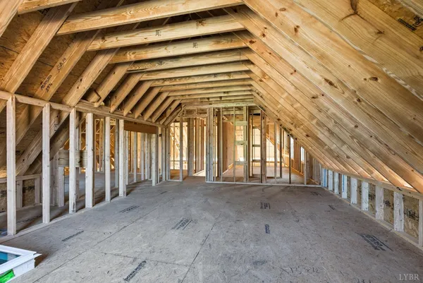 a view of a hallway with wooden stairs