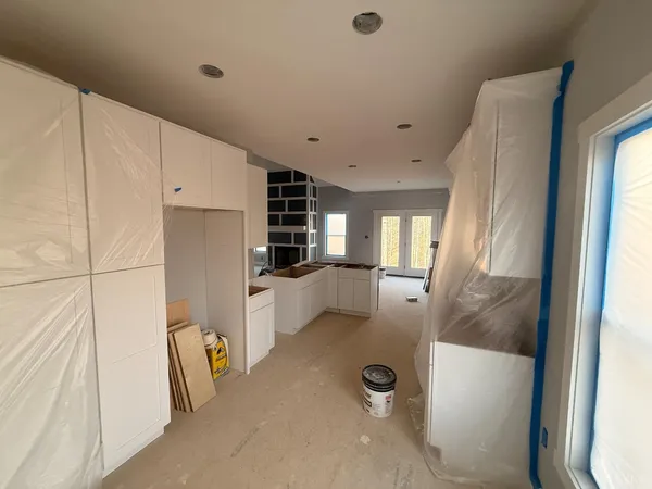 a room with furniture a rug and a window