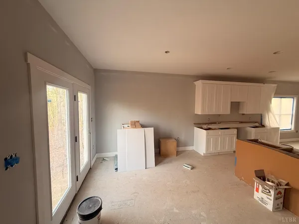 a view of a livingroom with a fireplace and window