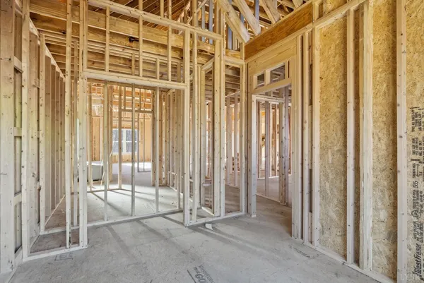 a view of an entryway with wooden floor and door