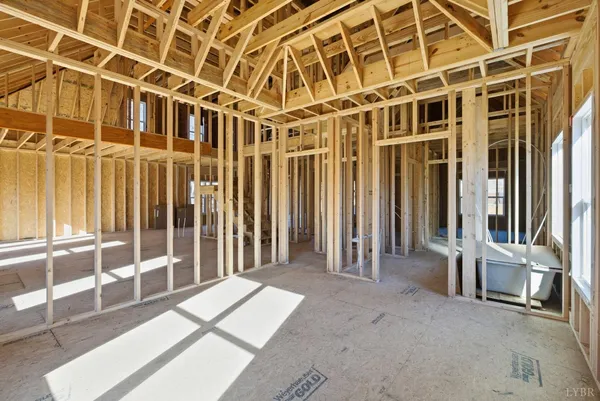 a view of a balcony with wooden floor and door