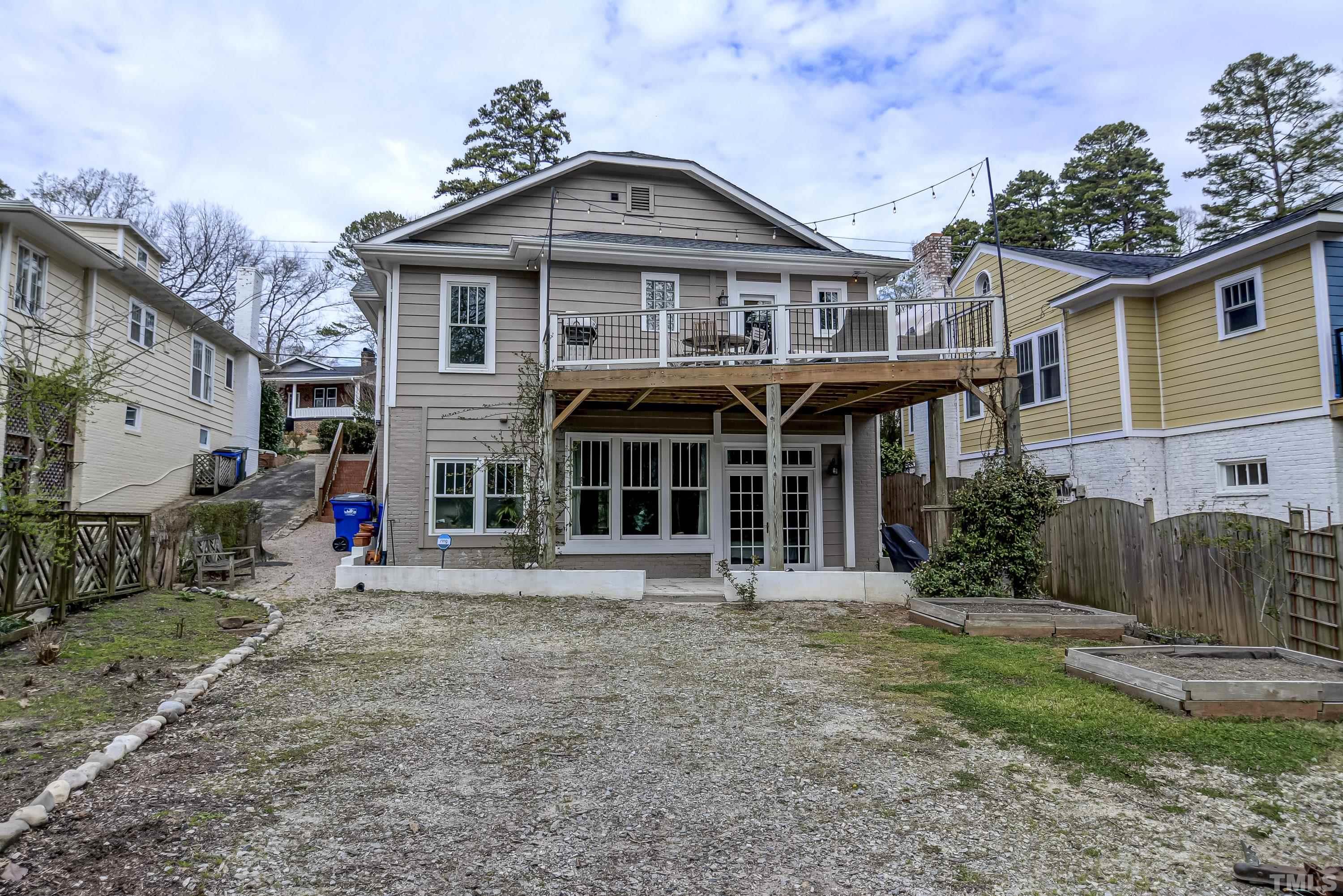 1924 Alexander Road Raleigh, NC 27608 - Photo 24 of 26 a front view of a house with a yard