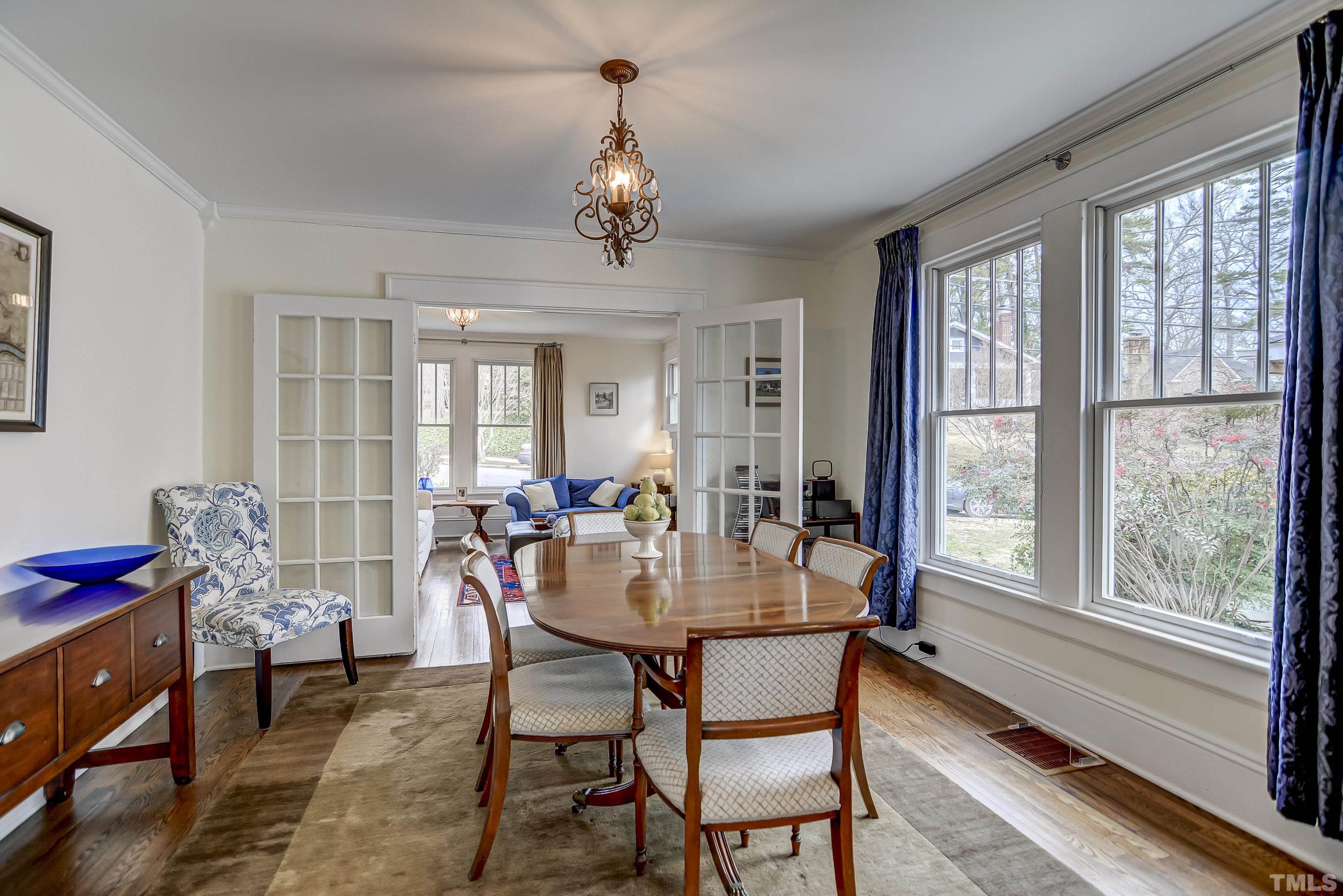 1924 Alexander Road Raleigh, NC 27608 - Photo 5 of 26 a view of a dining room with furniture window and outside view