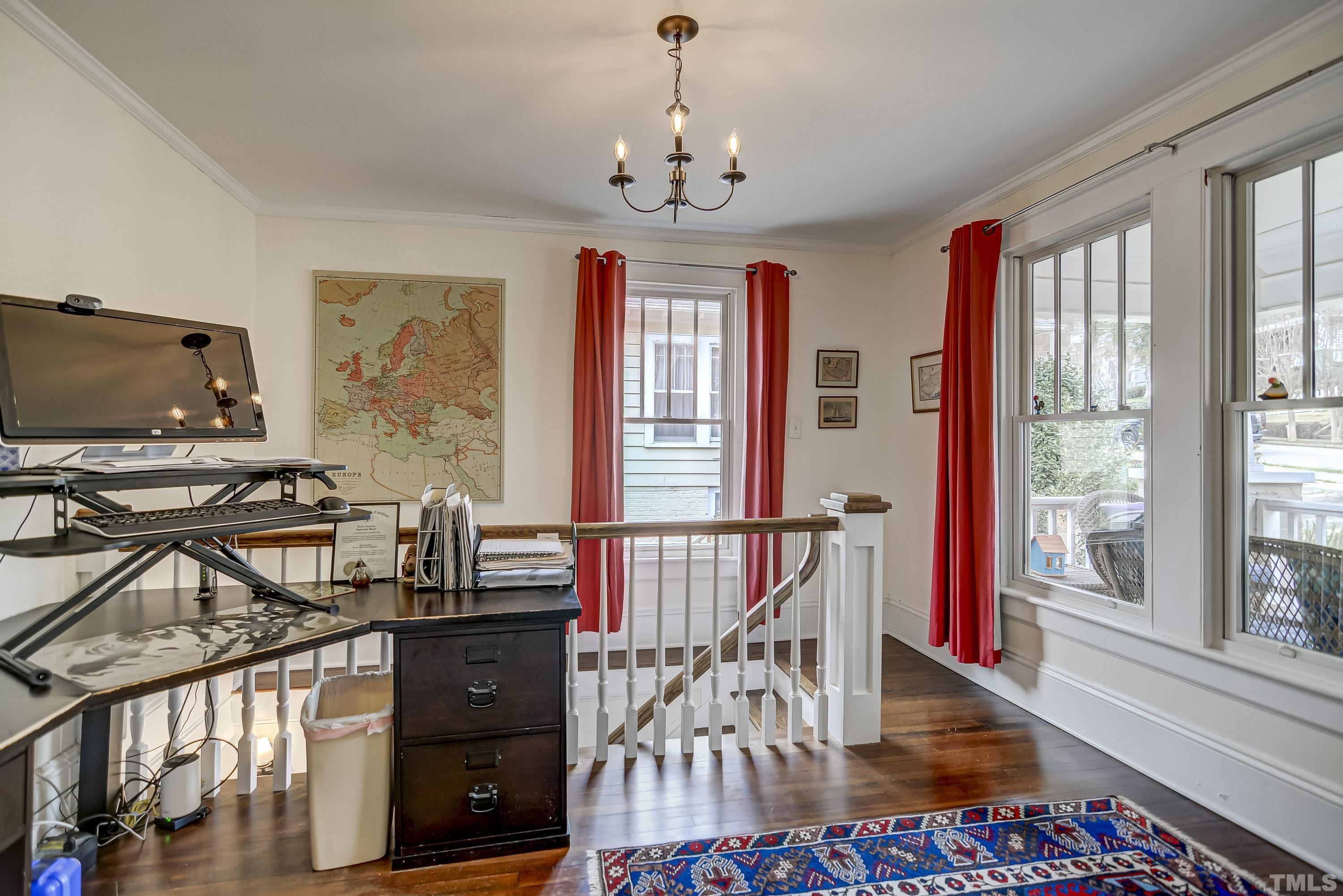 1924 Alexander Road Raleigh, NC 27608 - Photo 10 of 26 a view of a dining room with furniture window and wooden floor