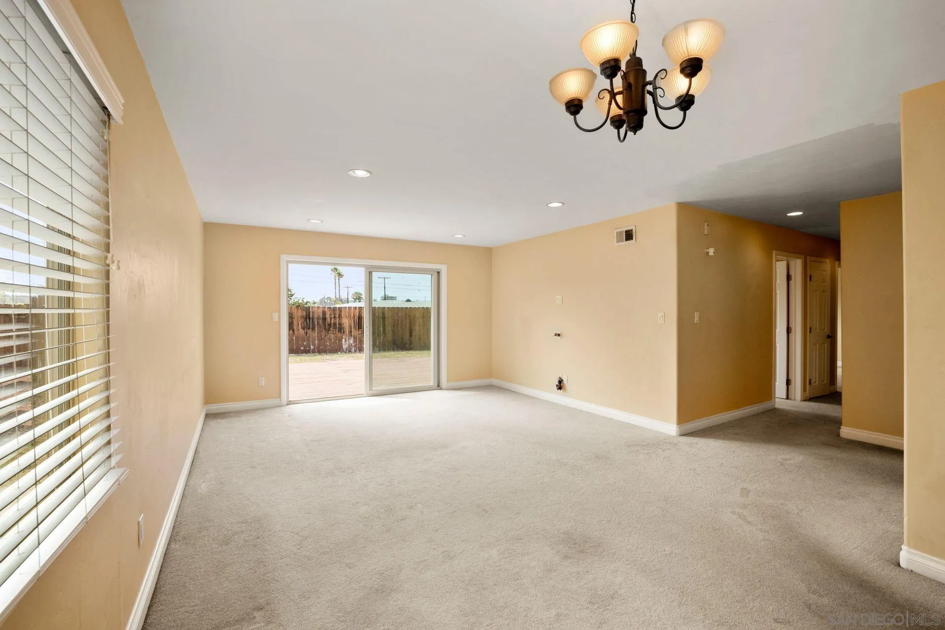 2742 Murray Ridge Road San Diego, CA 92123 - Photo 12 of 34 wooden floor in an empty room with a window