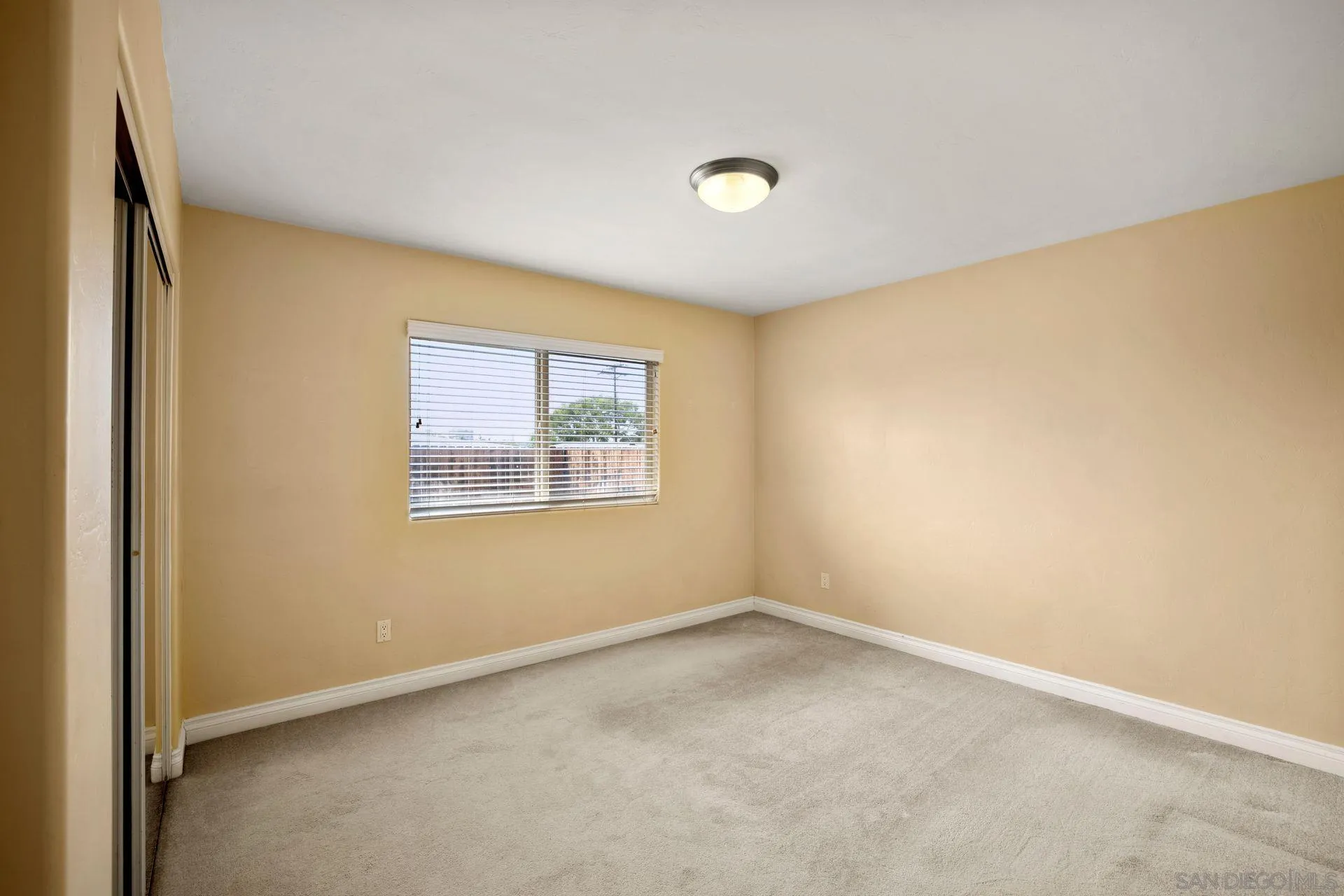 2742 Murray Ridge Road San Diego, CA 92123 - Photo 23 of 34 an empty room with a window