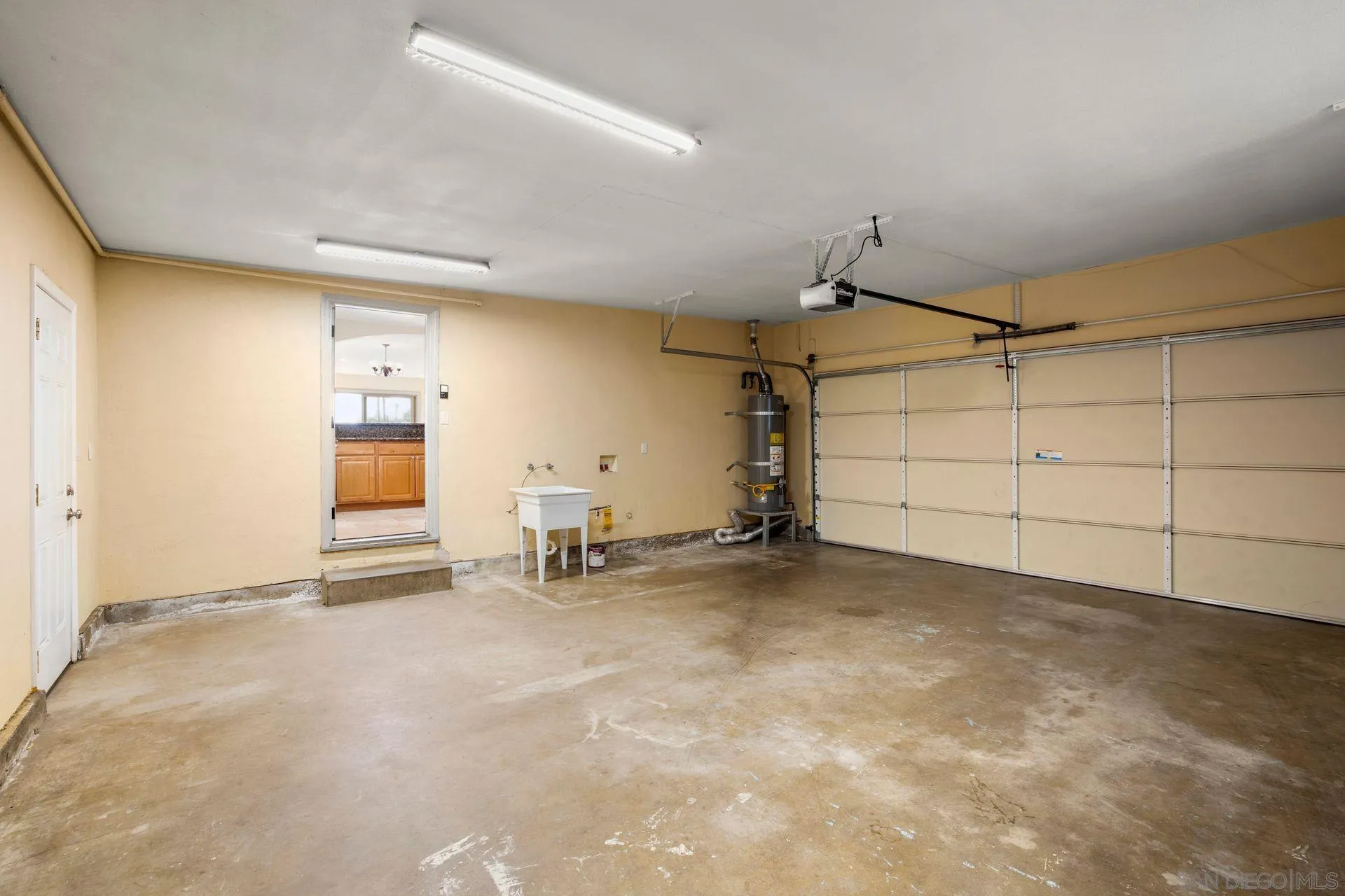 2742 Murray Ridge Road San Diego, CA 92123 - Photo 27 of 34 an empty room with ceiling fan and windows