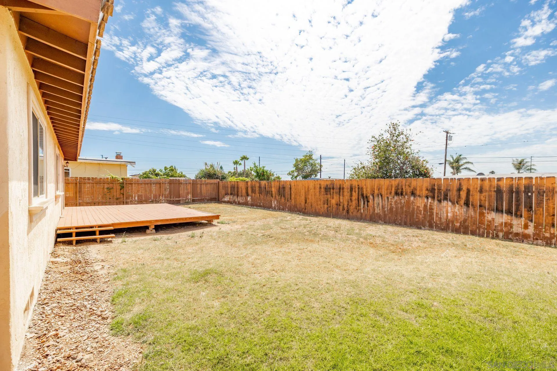 2742 Murray Ridge Road San Diego, CA 92123 - Photo 33 of 34 a view of a room with wooden fence